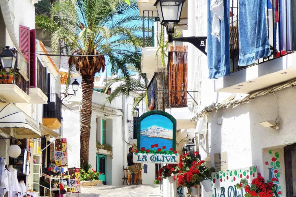 narrow alley in Ibiza with little shops everywhere