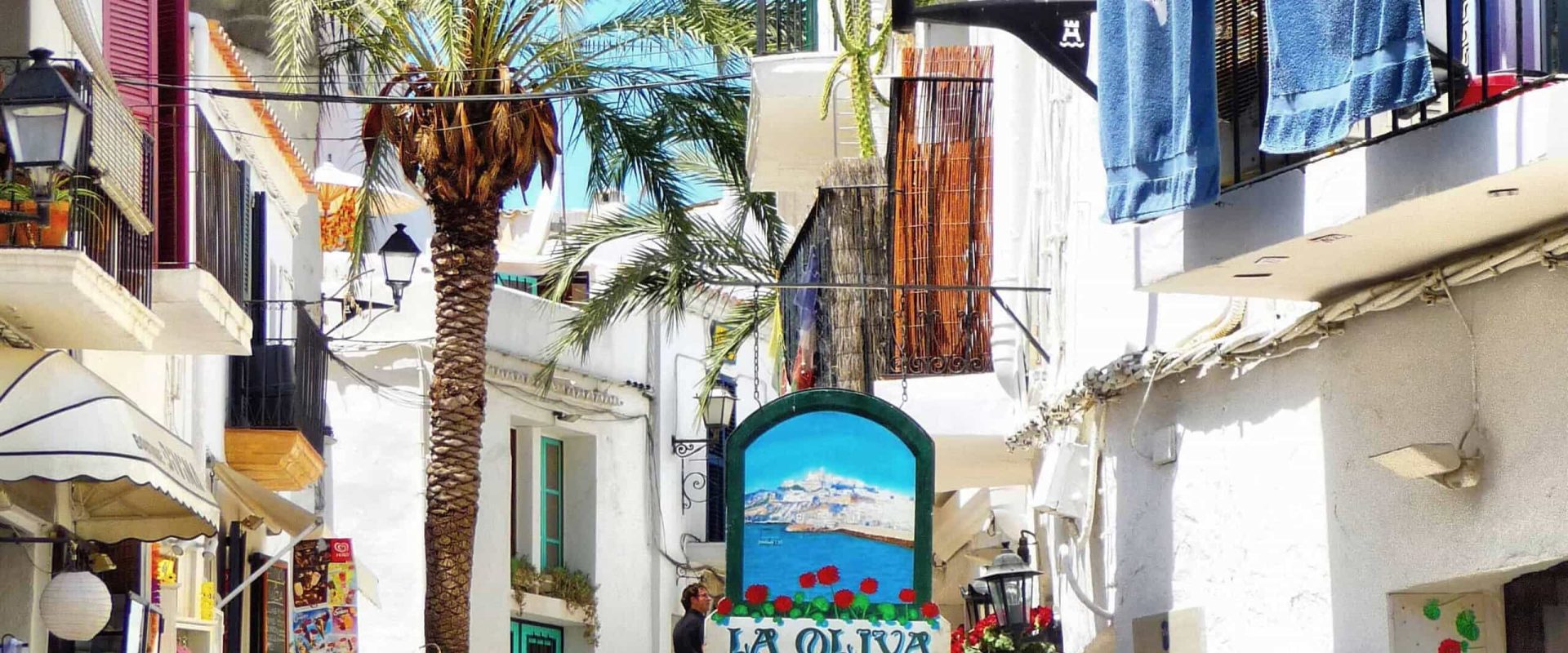 narrow alley in Ibiza with little shops everywhere