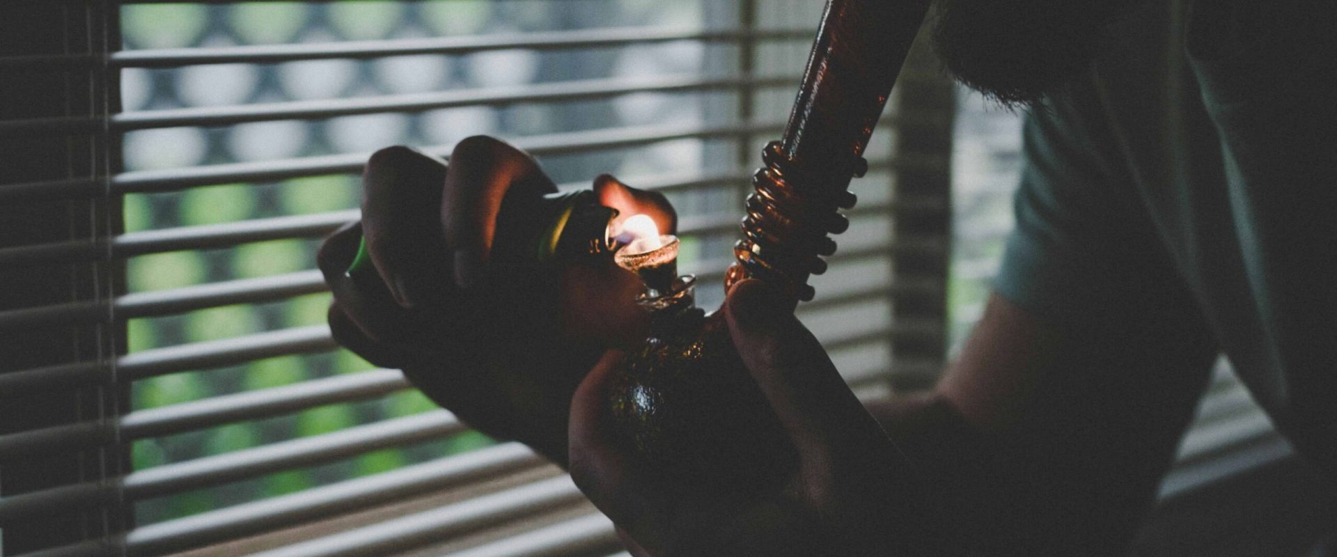 Guy-with-Bong Guy smoking Cannabis Bong Clipper Lighter